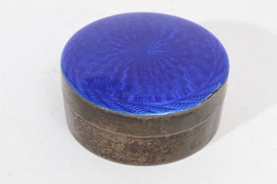 Lot 398 - 1920s silver box of circular form, with slip on blue guilloché enamel cover