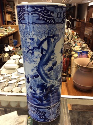 Lot 375 - Blue and white ceramic stick stand with landscape scene decoration