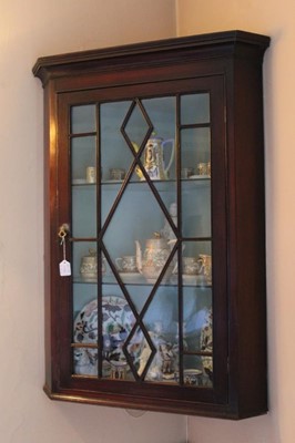 Lot 1372 - Two Georgian mahogany hanging corner cupboards, one with dentil cornice, both with astragal glazed doors, 76cm and 73cm wide