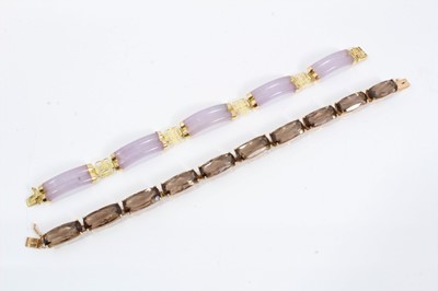 Lot 206 - Smoky quartz bracelet in gold setting stamped 10k