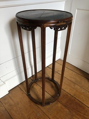 Lot 1379 - 19th century Chinese hardwood stand, the circular top supported on five reeded legs joined by shaped stretchers, 37cm diameter x 79cm high