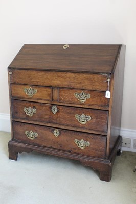 Lot 1380 - George I oak bureau, the hinged fall front enclosing a fitted interior, above two short and two long drawers, on bracket feet, 82cm wide x 49cm deep x 96cm high