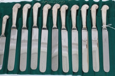 Lot 301 - Set of 10 dinner knives and 10 matching dessert knives, with Victorian silver pistol grip handles