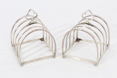 Lot 304 - Pair 1920s silver four division toast racks