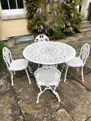 Lot 1400 - Victorian-style white painted metal garden table and four matching chairs, the table top with pierced foliate design on scroll legs, 100cm diameter