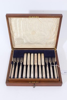 Lot 311 - 1920s silver dessert set comprising 12 pairs of knives and matching forks