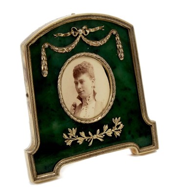 Lot 9 - Fabergé-style silver gilt and green nephrite photograph frame containing an Edwardian portrait photograph of H.R.H. Princess Mary of Wales ( later H.M. Queen Mary) with swag and ribbon decoration,...