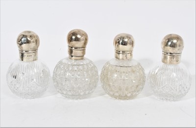 Lot 321 - Two pairs of silver mounted glass perfume bottles of globular form