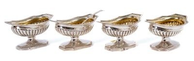 Lot 322 - Set of four George III silver salts of compressed campana form, with gilded interiors