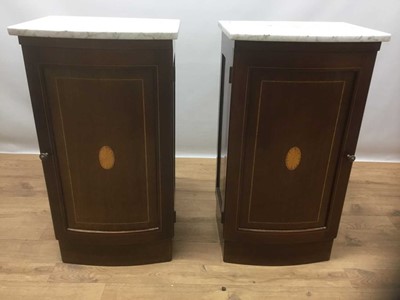 Lot 1425 - Pair of Edwardian inlaid mahogany bedside cupboards, the bow fronted white marble tops above slightly bowed panelled doors, on plinth bases, 43cm wide x 35cm deep x 78cm high