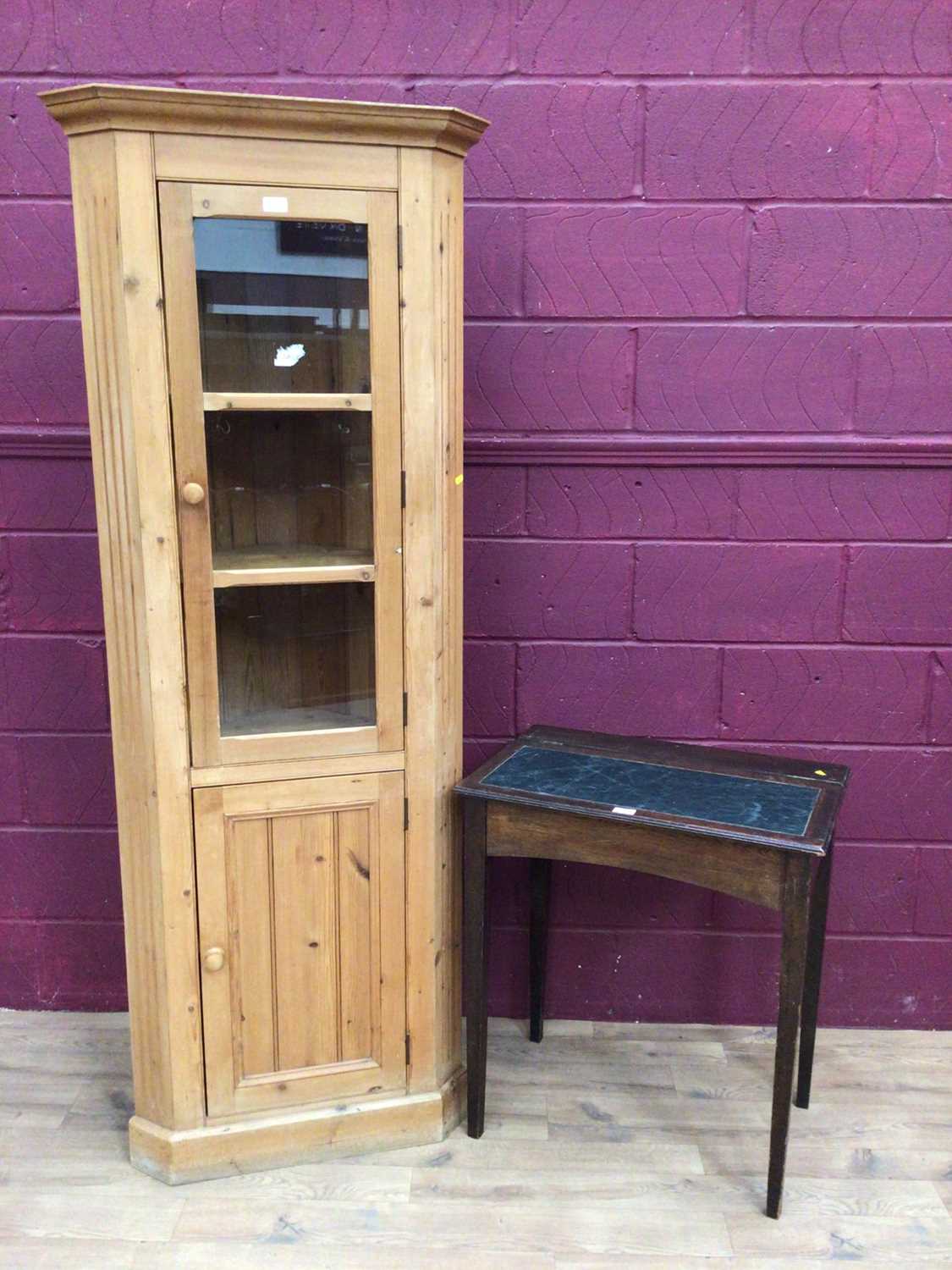 Lot 337 - Edwardian oak desk with leather top and a pin corner cupboard with glazed and panelled door (2)