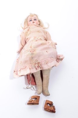 Lot 1618 - Antique German Ernst Heubach doll. Bisque head and shoulders Horseshoe mark D 5/0, composite limbs, fabric body with purple stamped mark on leg. Sleeping blue eyes, printed lips, lashes, brows, socks.