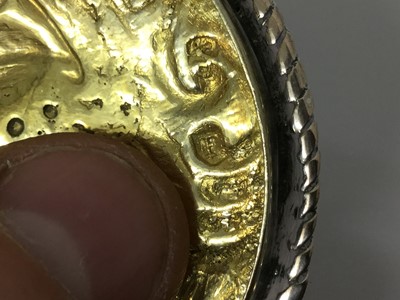 Lot 421 - Late 19th/early 20th century white metal box of circular form, with gilded interior