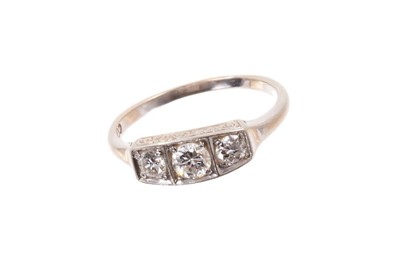 Lot 599 - Diamond three stone ring with three old round brilliant cut diamonds in platinum box shape setting on 18ct gold shank. Estimated total diamond weight approximately 0.48cts.