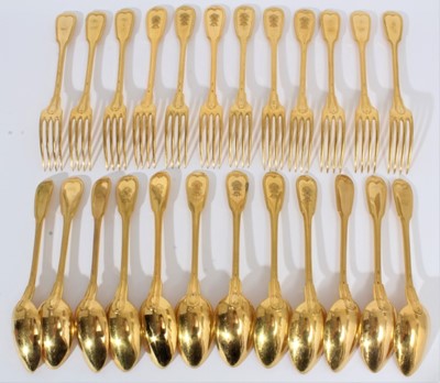 Lot 15 - Late 19th French gilded fiddle thread pattern dessert flatware by Christofle, Paris, some engraved with Continental coronet and arms, comprising 12 dessert knives and 12 dessert forks (24) Provenan...