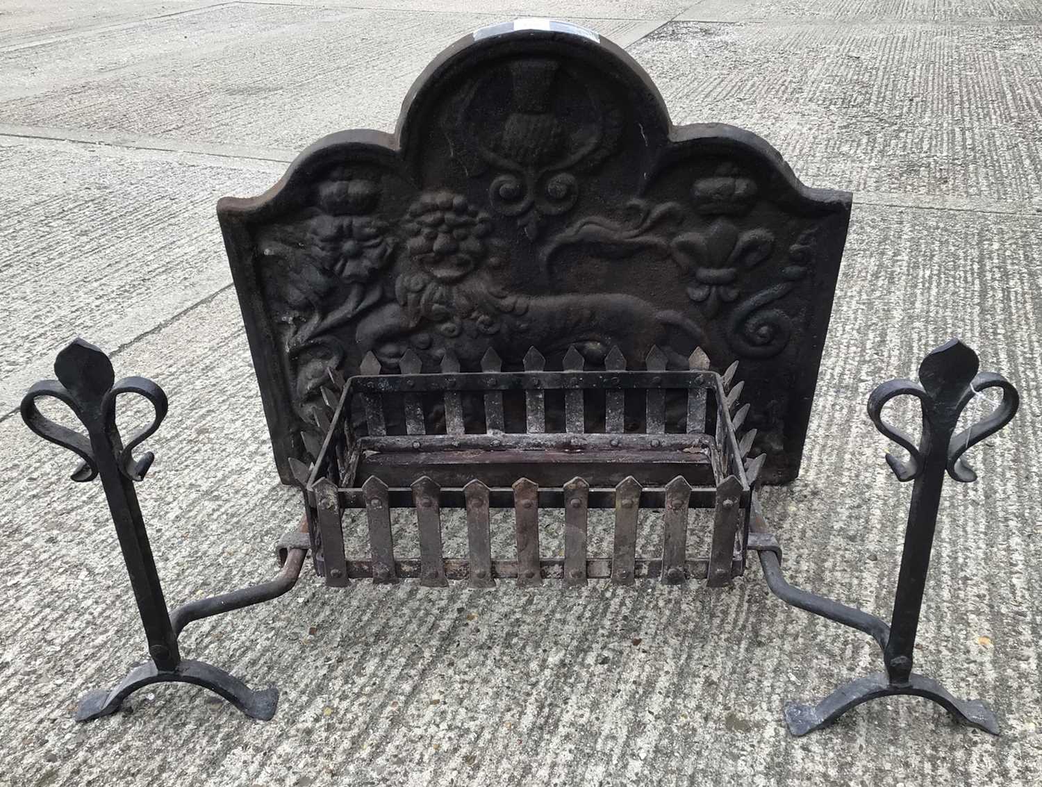 Lot 1539 - Cast iron fire back, fire basket and firedogs