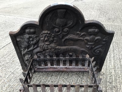 Lot 1539 - Cast iron fire back, fire basket and firedogs