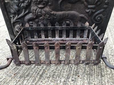 Lot 1539 - Cast iron fire back, fire basket and firedogs