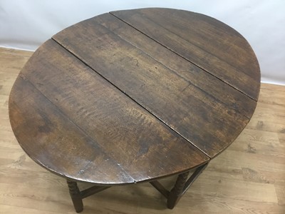 Lot 943 - 17th century oak drop leaf table