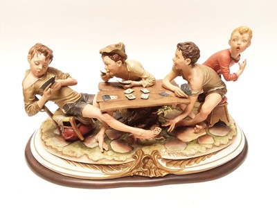 Lot 1040 - Very large Capodimonte figural group - 'cheats card game', on wooden plinth