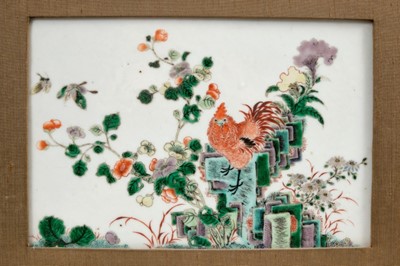 Lot 103 - Chinese famille verte porcelain plaque, Qing period, decorated with a cockerel standing on a rocky outcrop, with flowers and butterflies, in later frame, the plaque 22cm x 14.5cm
