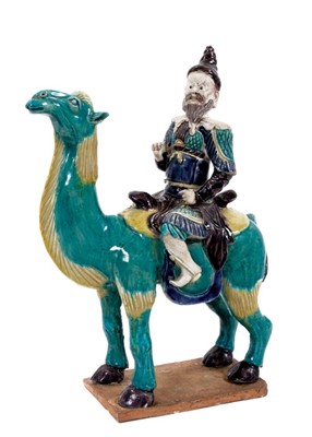 Lot 104 - Unusual Chinese ceramic model of a camel and rider, late Qing period, painted in turquoise, yellow, aubergine and blue, the rider with unusual pointed hat and possibly representing a Western trader...