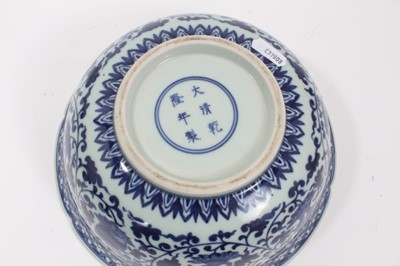 Lot 112 - Chinese blue and white vase and bowl, 20th century, both decorated with floral patterns and with seal marks, the vase measuring 20cm high