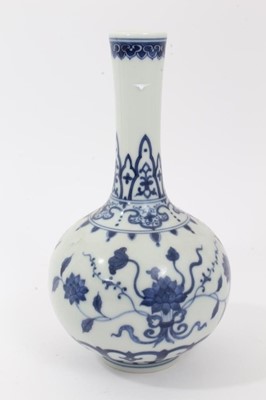 Lot 112 - Chinese blue and white vase and bowl, 20th century, both decorated with floral patterns and with seal marks, the vase measuring 20cm high