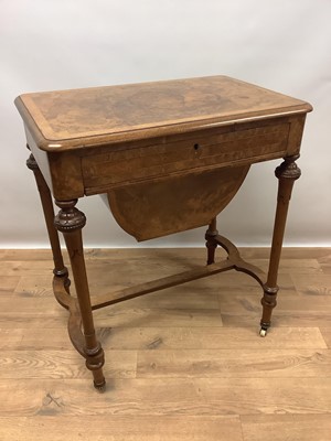 Lot 1498 - A Victorian burr walnut sewing table