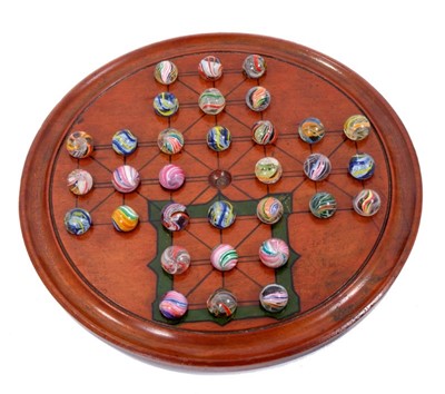 Lot 870 - A Victorian solitaire board (also marked for the game of Fox and Geese) with antique glass marbles