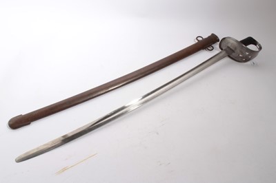 Lot 950 - Victorian 1885 pattern Cavalry Troopers Sword with curved fullered blade, stamped EFD, steel hilt and black checkered grip, in scabbard with original field camouflage paint, blade 84.5cm in length