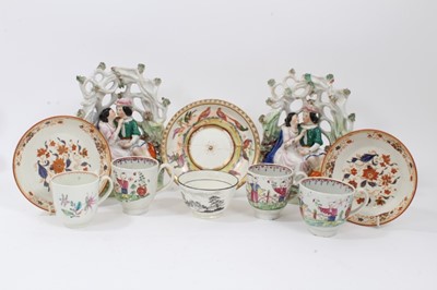 Lot 123 - Small collection of 18th and 19th century English ceramics, including a Worcester cup, three chinoiserie pearlware cups, a pair of Staffordshire figures, three saucers and a tea bowl (10)