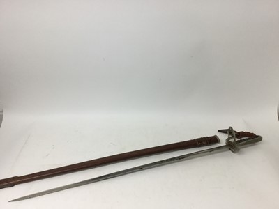 Lot 951 - Elizabeth II Royal Army Service Corps Officers' sword by Wilkinson Sword ( No 77662 ) with three bar hilt, leather knot, etched blade with regimental badge and crowned ER cipher in leather field se...