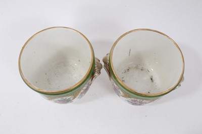 Lot 124 - Pair of Paris Feuillet porcelain planters, painted with floral sprays on a green and gilt-patterned ground, inscribed marks to bases, 12cm high, together with a dish and sucrier both with Sevres st...