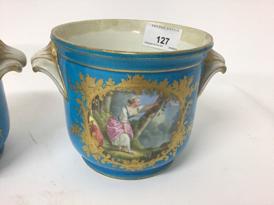 Lot 127 - Pair of 19th century Sèvres bleu celeste planters, painted with panels containing figures and emblems of music, together with a similar sucrier and cover painted with cherubs and flowers