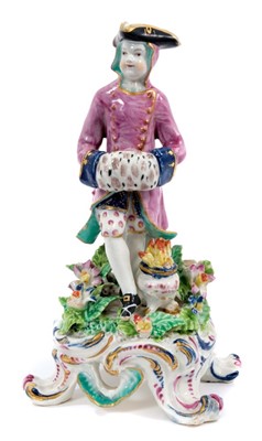 Lot 135 - Bow porcelain figure of Winter, circa 1765, modelled as a seated gentleman with his hands in a muff, a brazier at his feet, on a scrollwork base, 19.5cm high