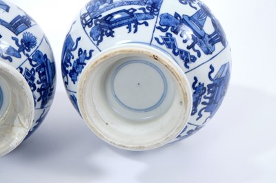 Lot 152 - Pair of Chinese blue and white porcelain bottle vases, Kangxi style but 19th/20th century, decorated with panels of figures and precious objects, double-ring marks, 27cm high