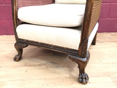 Lot 322 - Edwardian carved mahogany bergere sofa and armchair