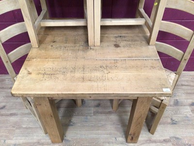 Lot 929 - Contemporary light oak dining table and four matching ladder back chairs with rush seats