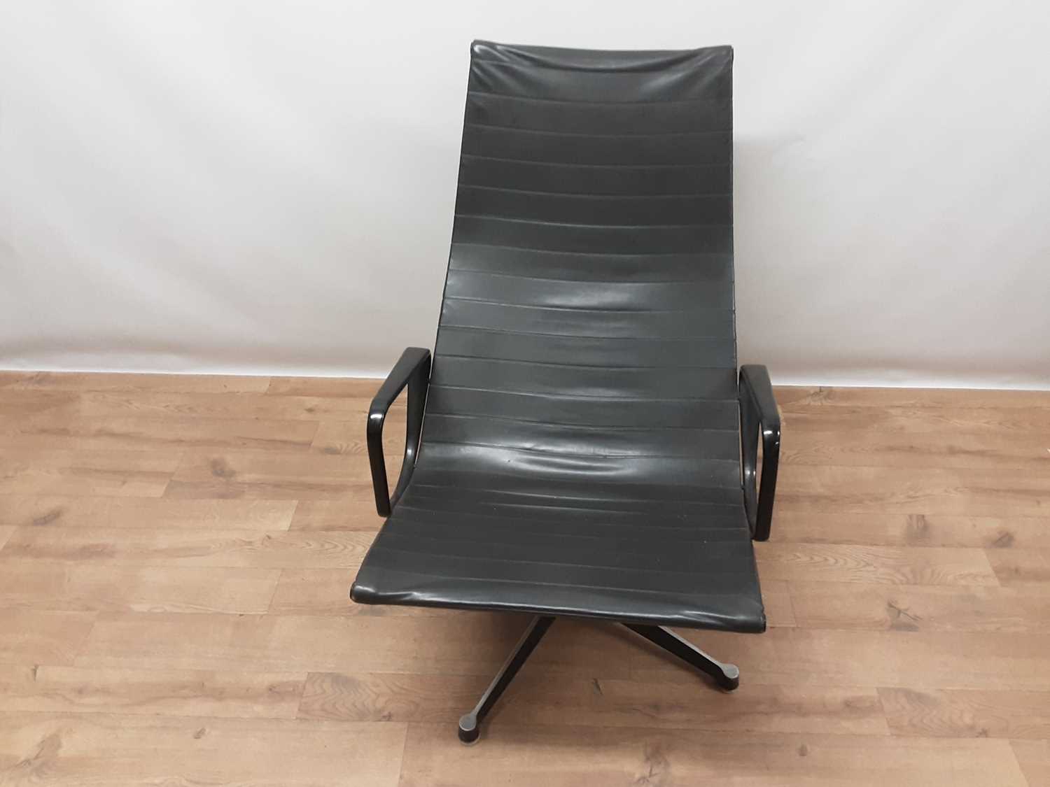 Lot 899 - Vintage aluminium and leather swivel lounge chair in the manner of Charles and Ray Eames
