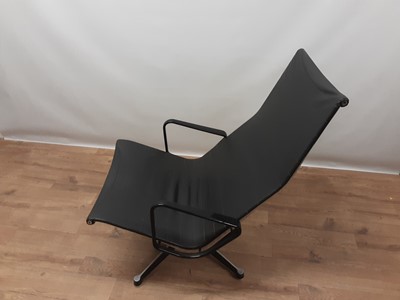 Lot 1095 - Vintage aluminium and leather swivel lounge chair in the manner of Charles and Ray Eames