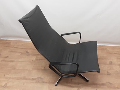 Lot 1095 - Vintage aluminium and leather swivel lounge chair in the manner of Charles and Ray Eames