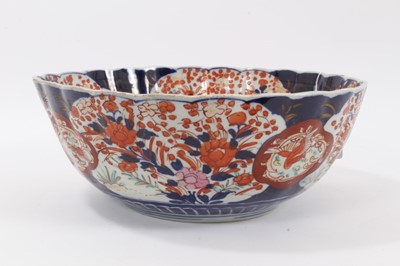 Lot 160 - A large Japanese Imari Charger, Edo period, 17th/18th century, the centre decorated with a vase of flowers, bordered by exotic birds and foliate patterns, 53.5cm diameter, together with a 19th cent...