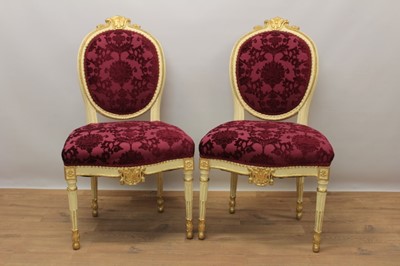 Lot 1528 - Pair 18th Russian giltwood and cream painted chairs with red upholstery