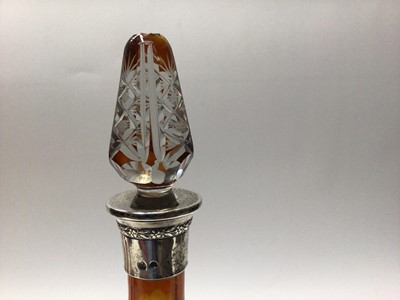 Lot 64 - Bohemian amber cut glass decanter and stopper, of tapered form with Continental white metal mount, together with four matching glasses (5)