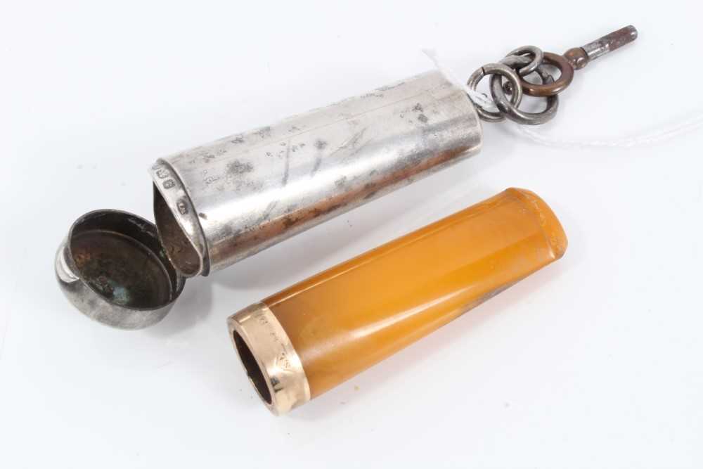 Lot 64 - Early 20th century 15ct gold mounted amber cigar holder within a silver case