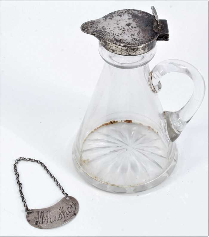 Lot 65 - Silver mounted glass whisky decanter and a silver whisky label