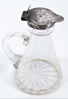 Lot 65 - Silver mounted glass whisky decanter and a silver whisky label