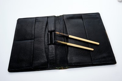 Lot 21 - Good quality Victorian black leather writing wallet containing two dip pens, retailed by Clark, 20 Old Bond Street, with gilt Barons coronet and initials to cover.