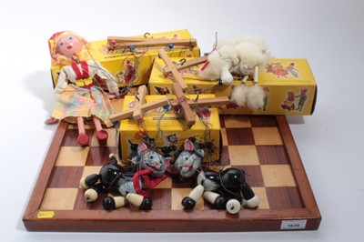 Lot 1639 - Four Pelham puppets and an antique wooden chess board